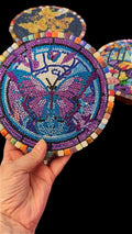 Colorful butterfly crystal mosaic trivet and decorative display with intricate design and vibrant glass accents.