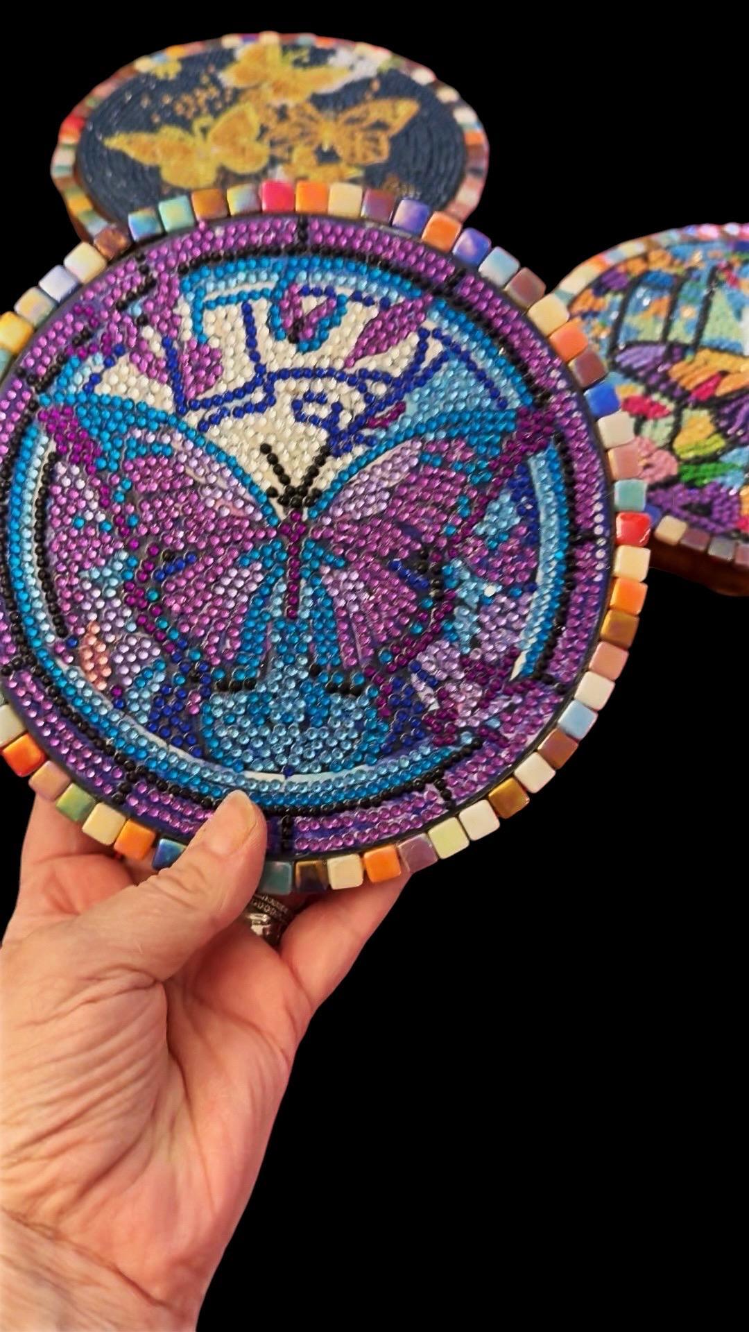 Colorful butterfly crystal mosaic trivet and decorative display with intricate design and vibrant glass accents.