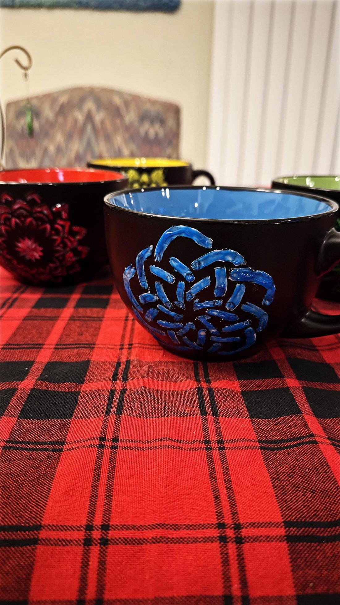 Handpainted extra large coffee mug with colorful floral design, showcasing artistic details and a spacious handle.