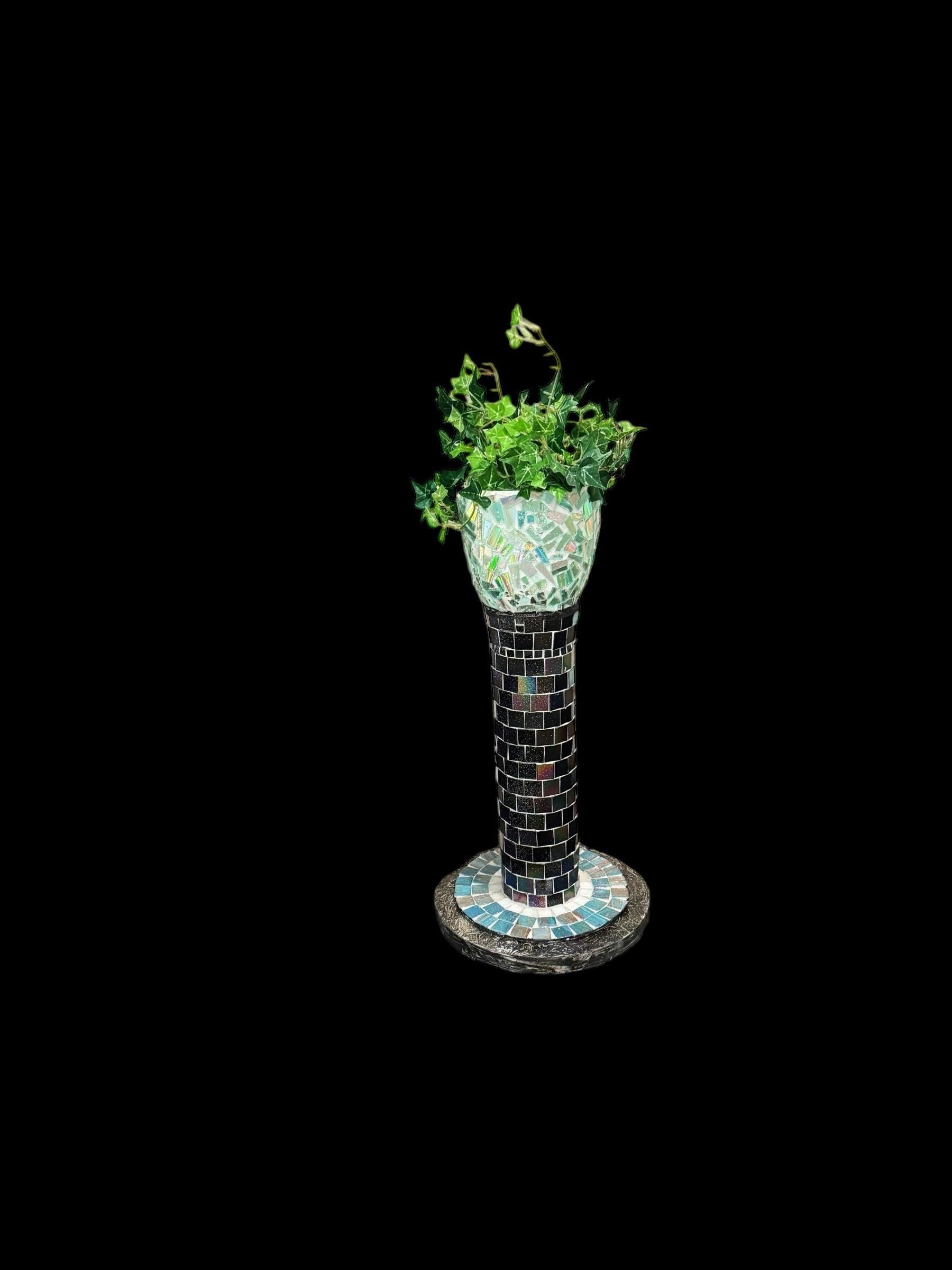Handcrafted mosaic pedestal planter with colorful tile design, perfect for outdoor or indoor plant display.