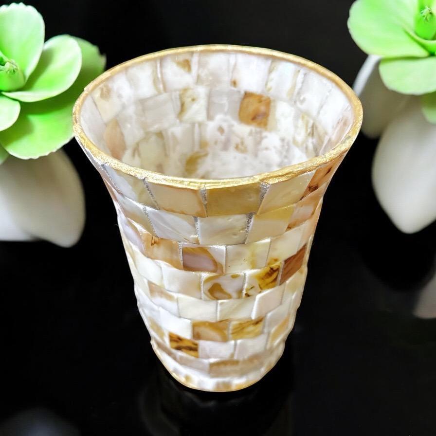 Handcrafted tapered mosaic vase with mother of pearl inlay, showcasing intricate design and shimmering surface.