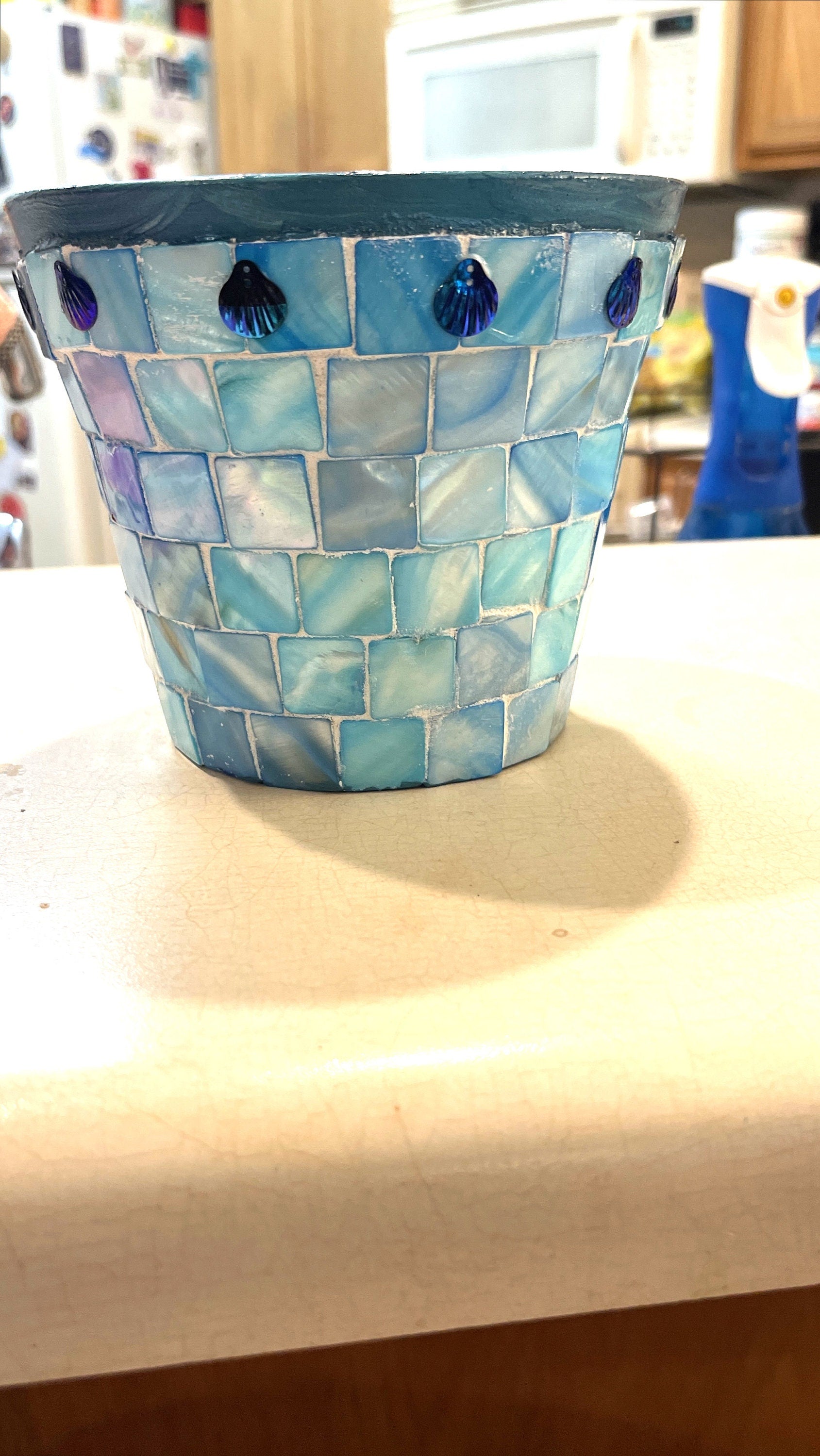 Artisan teal mosaic planter with mother of pearl accents from Miss Bette's Creations, showcasing intricate tile design and vibrant colors.