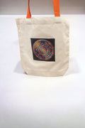 Handmade diamond art mandala design on canvas tote bag, showcasing vibrant colors and intricate geometric patterns.