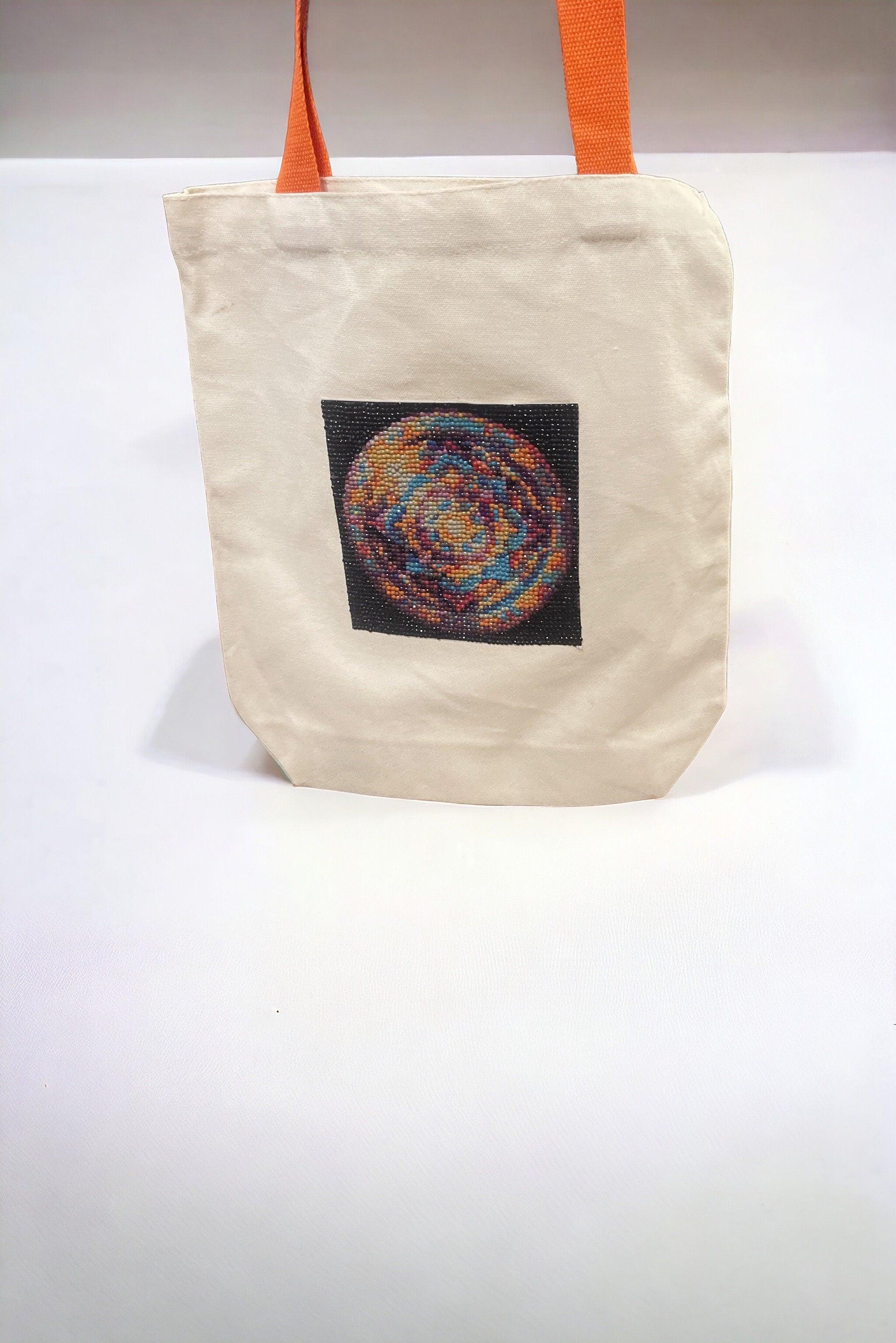 Handmade diamond art mandala design on canvas tote bag, showcasing vibrant colors and intricate geometric patterns.