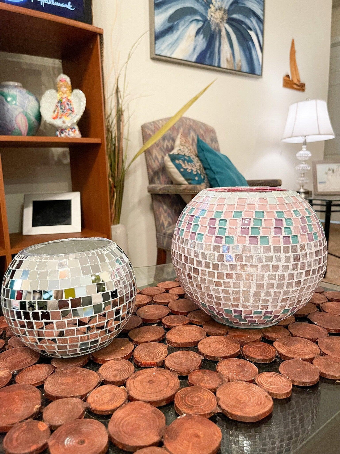 Artisanal disco ball globe vase with mirrored surface, decorative home decor piece reflecting light and adding modern style.