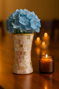 Elegant mother of pearl mosaic flower vase with floral pattern, featuring a glossy, reflective surface and intricate design.