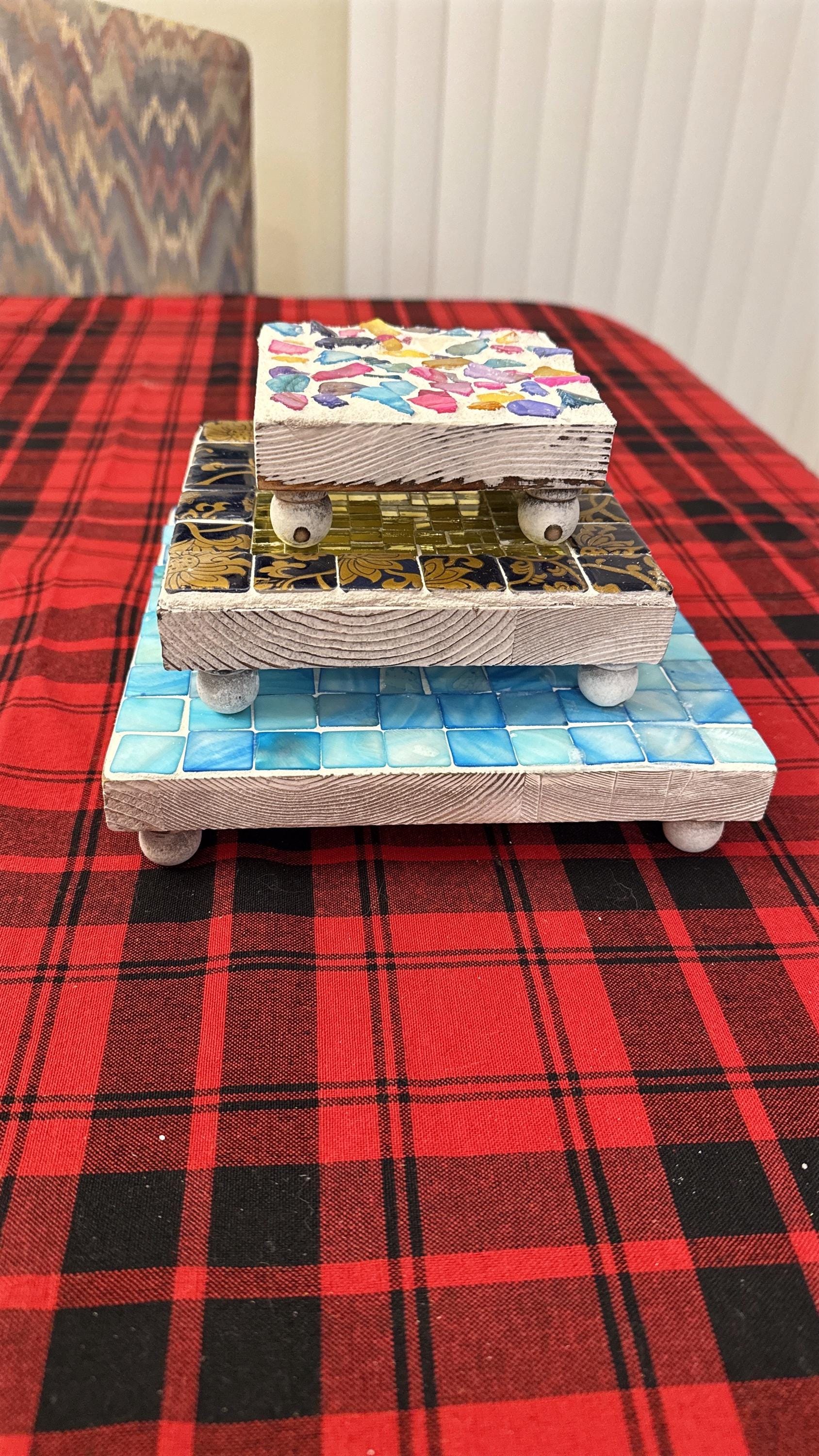 Square turquoise mother of pearl plant stand with handcrafted design, showcasing elegant, shiny surface and sturdy structure.