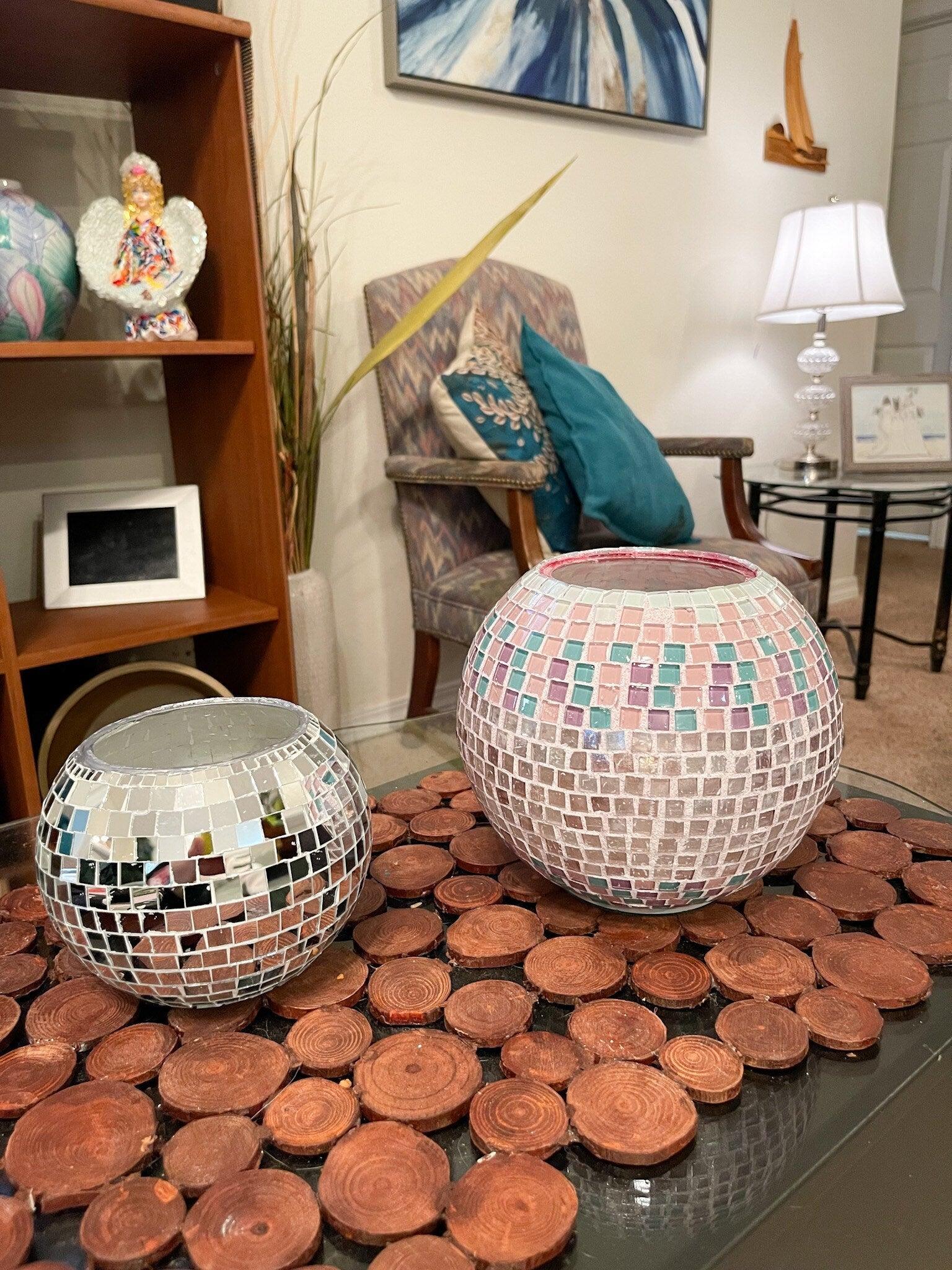 Artisanal disco ball globe vase with mirrored surface, decorative home decor item showcasing a shiny, spherical design.