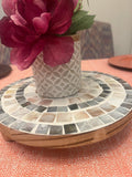 Handcrafted wooden mosaic plant stand with intricate tile design, perfect for displaying indoor or outdoor plants.