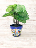 Colorful artisan rainbow mosaic planter with intricate tile design, perfect for indoor or outdoor decorative plants.