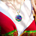 Colorful pendant necklace with vibrant beads and silver chain, showcasing a bohemian style jewelry accessory.