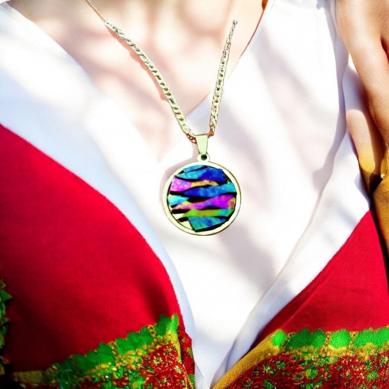 Colorful pendant necklace with vibrant beads and silver chain, showcasing a bohemian style jewelry accessory.