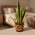 Colorful bouquet in a rainbow mosaic hexagon planter, showcasing vibrant flowers and decorative ceramic design.