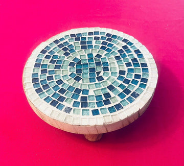 Handcrafted round turquoise glass mosaic plant riser with intricate tile pattern for decorative indoor or outdoor use