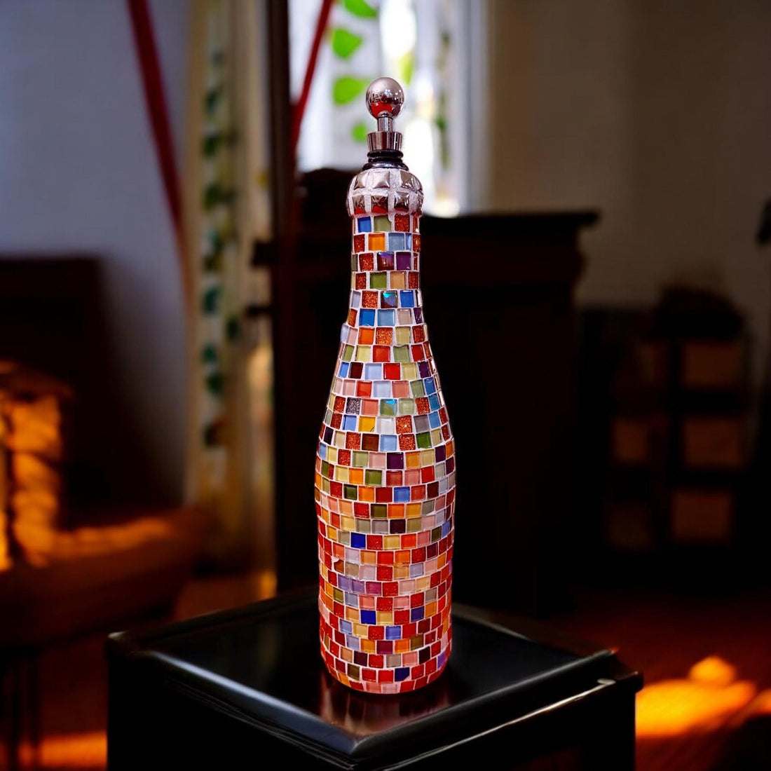 Multicolored mosaic wine decanter with artistic glass design, featuring a sleek shape and vibrant patterns for elegant wine serving.