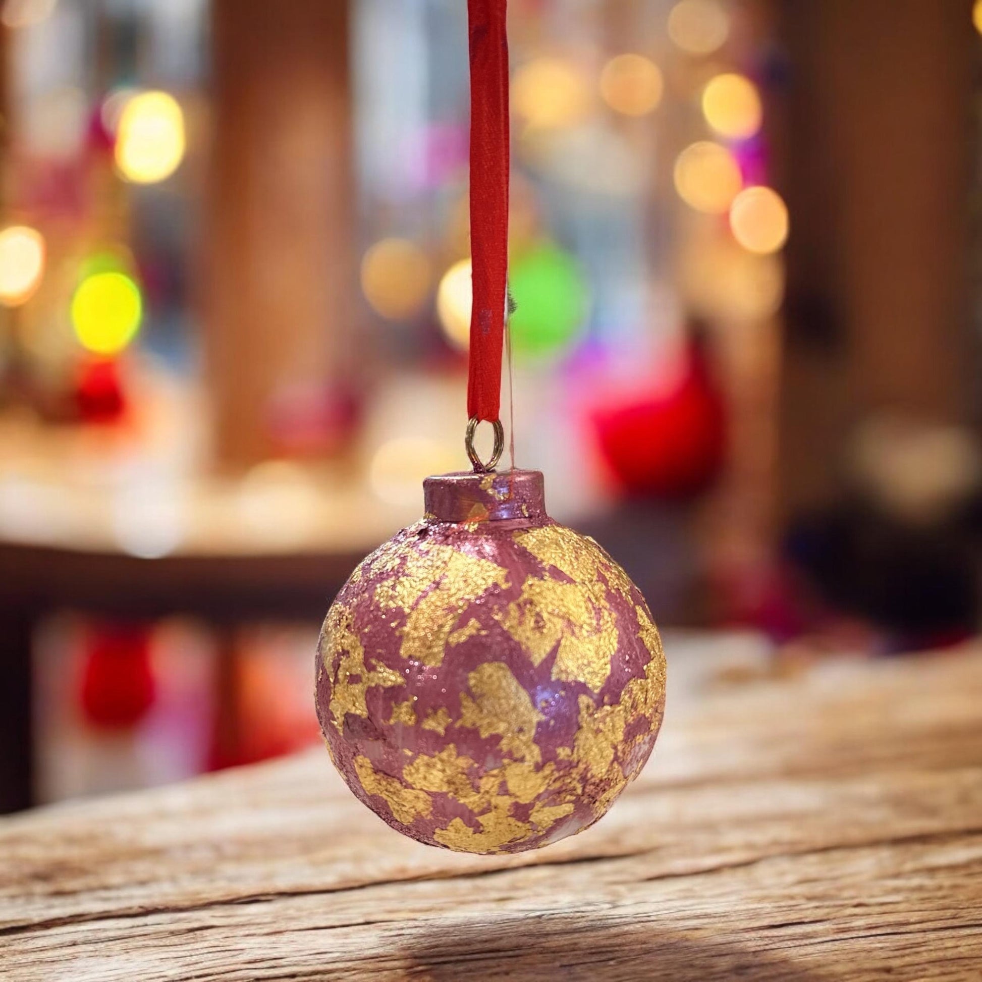 Rose and gold leaf Christmas ornament, decorative holiday decoration with floral design and metallic accents.