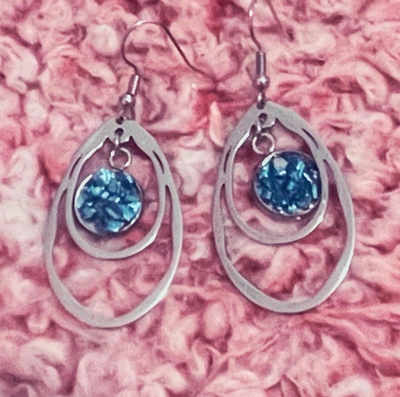 Blue mosaic drusy teardrop earrings featuring shimmering blue stone and silver hooks, elegant jewelry accessory.