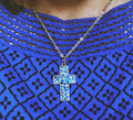 Handcrafted crushed crystal cross necklace with silver chain, featuring sparkling crushed crystal details and a religious pendant.