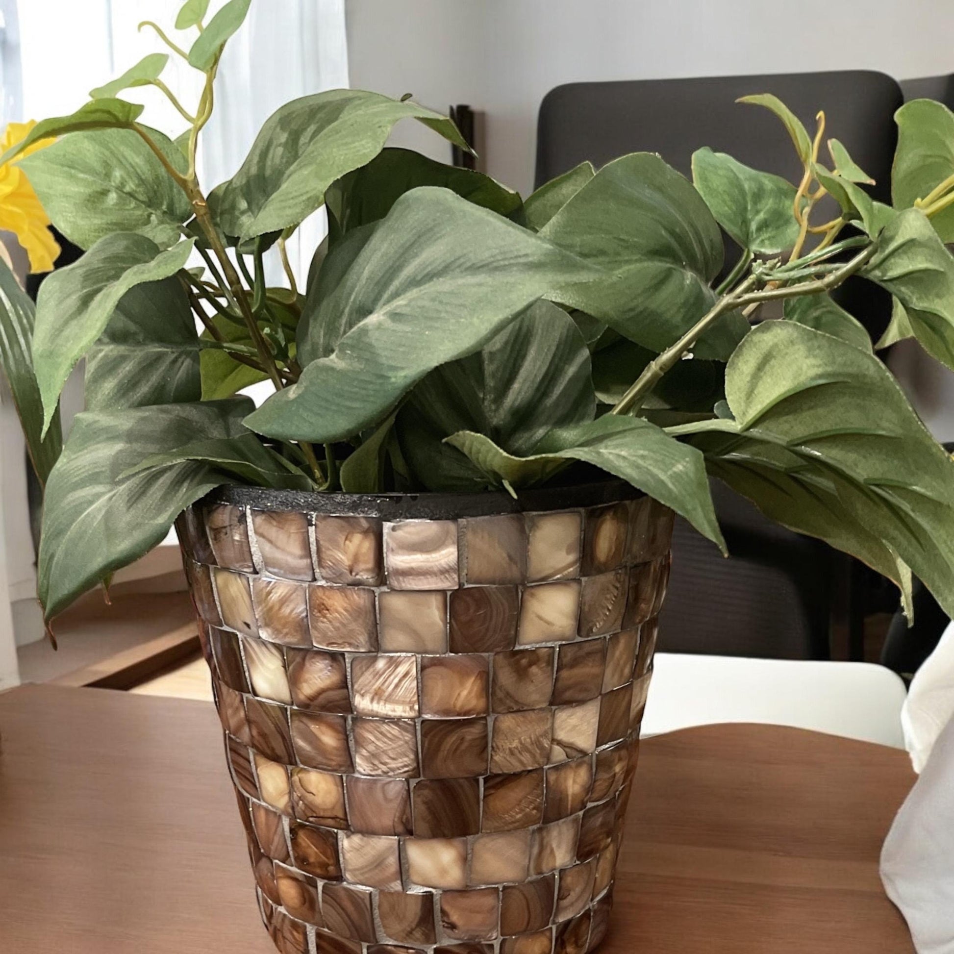 Handcrafted bronze and pearl mosaic planter with intricate design, perfect for adding elegance to indoor or outdoor garden spaces.