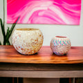 Luxurious scalloped planter with faux snake plant, decorative indoor plant container for modern home decor.