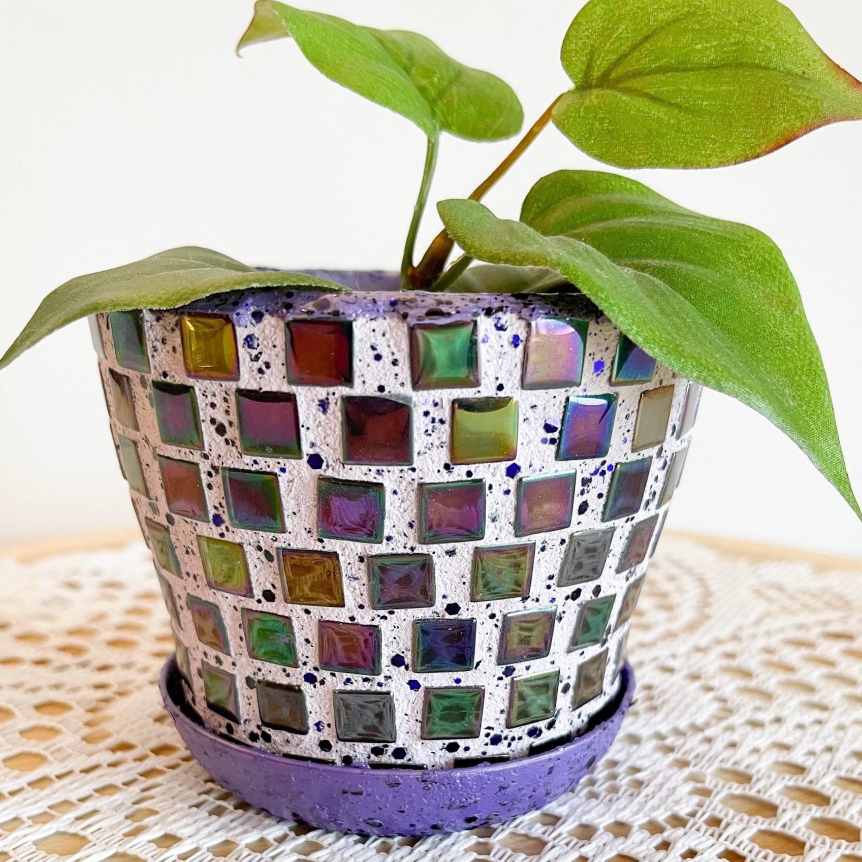Purple and green mosaic flower pot with floral design, decorative ceramic planter for indoor or outdoor plants.