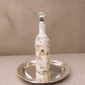 Mother of pearl mosaic wine decanter with intricate pattern and elegant design, crafted for storing and serving wine.