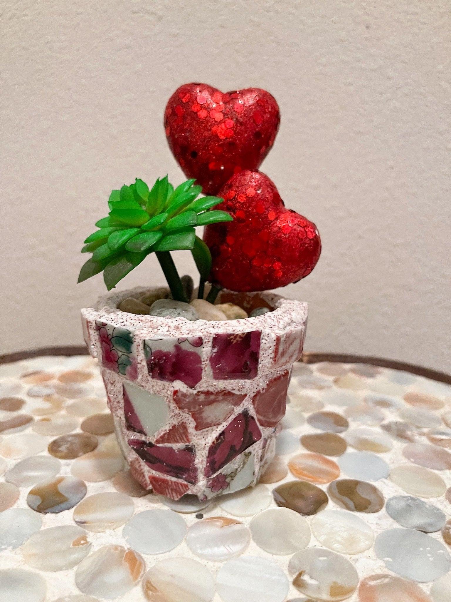 Handcrafted broken china heart mosaic planter with colorful tile design, perfect for indoor or outdoor decorative gardening.
