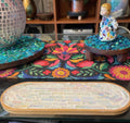 Rose quartz and slate mandala mosaic wall art featuring intricate geometric patterns and vibrant colors for decorative display.