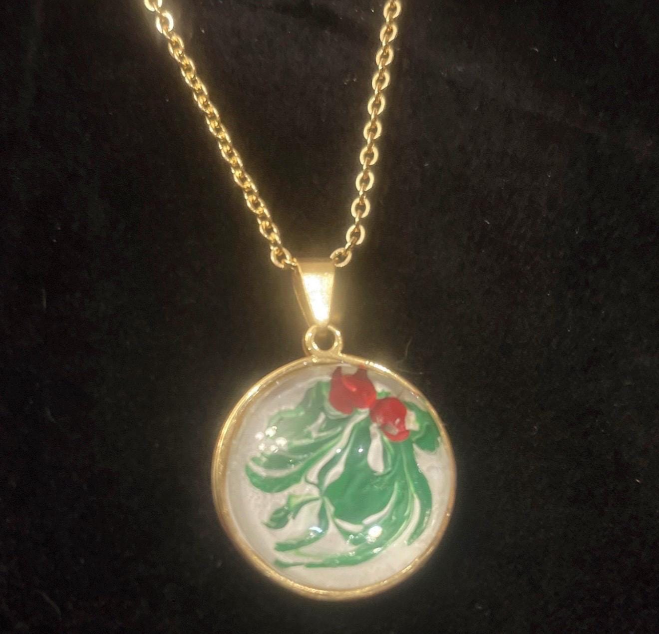 Christmas Holly Pendant Necklace featuring a festive holly charm on a silver chain, ideal for holiday jewelry.