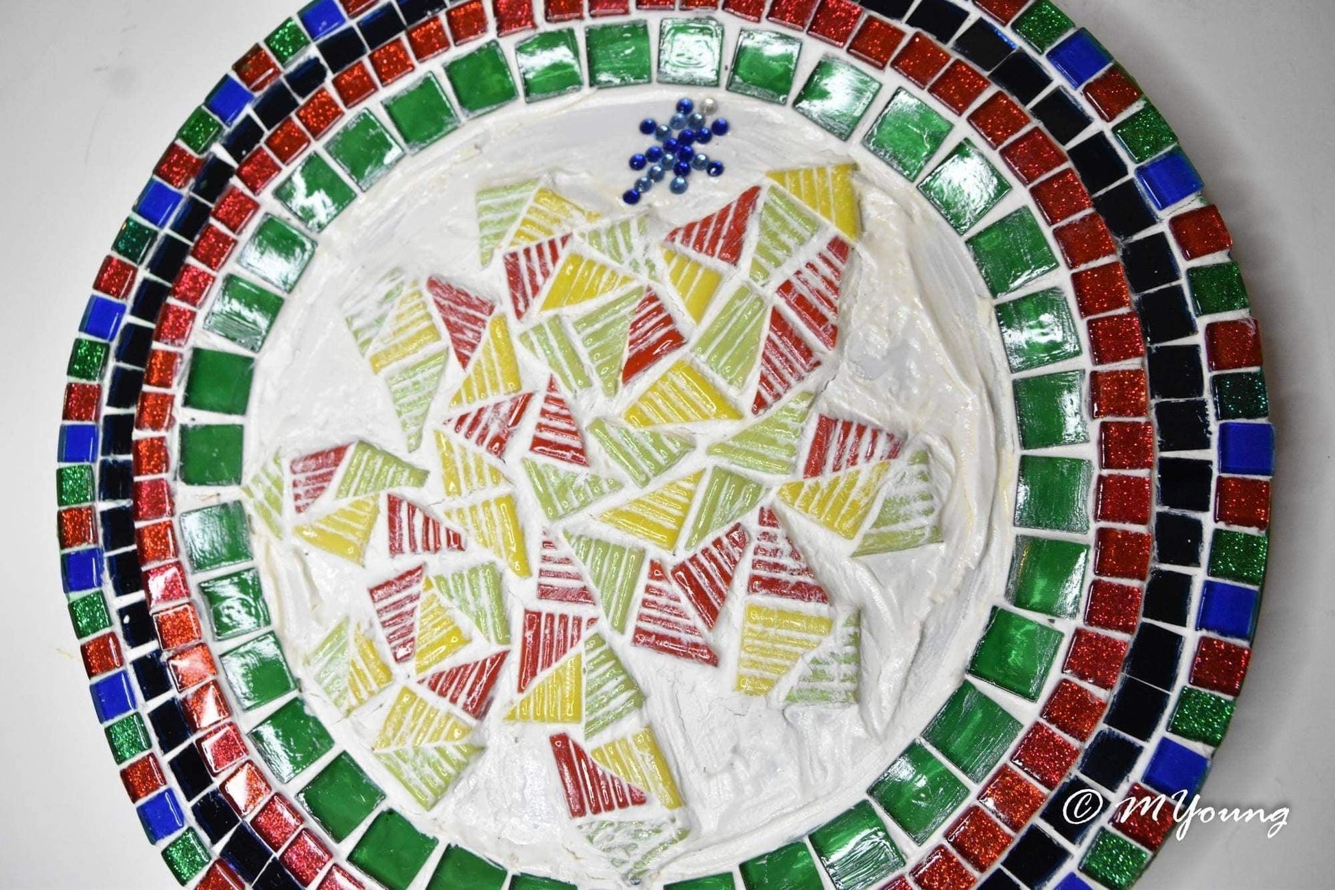 Artisan handcrafted round mosaic decorative plate with colorful tile patterns, ideal for wall display or as a decorative piece
