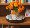 Handcrafted pink and green mosaic plant stand by Miss Bette's Creations with intricate tile patterns and a sturdy wooden base.