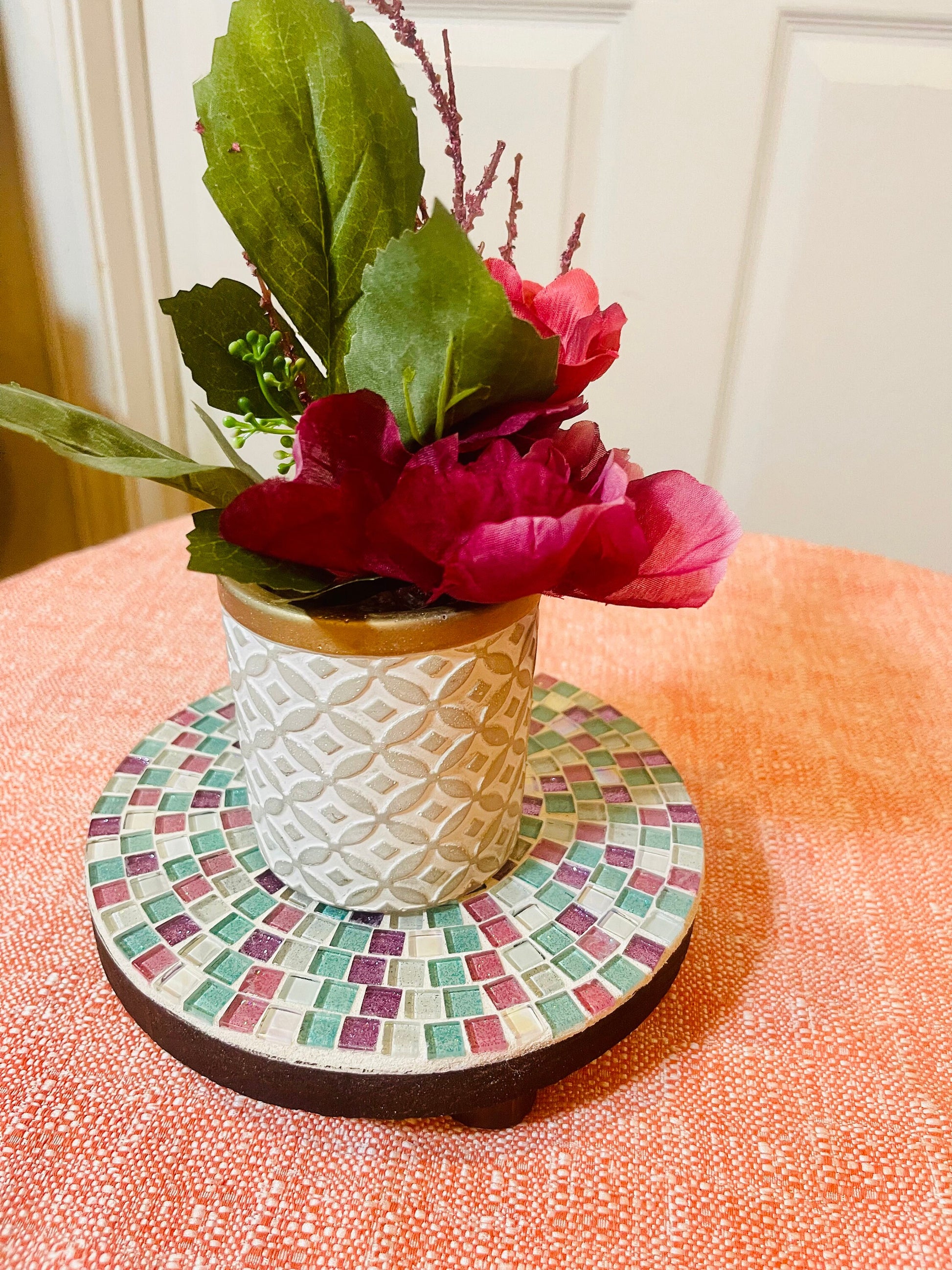 Handcrafted pink and green mosaic plant stand by Miss Bette's Creations, featuring intricate tile patterns and sturdy design.