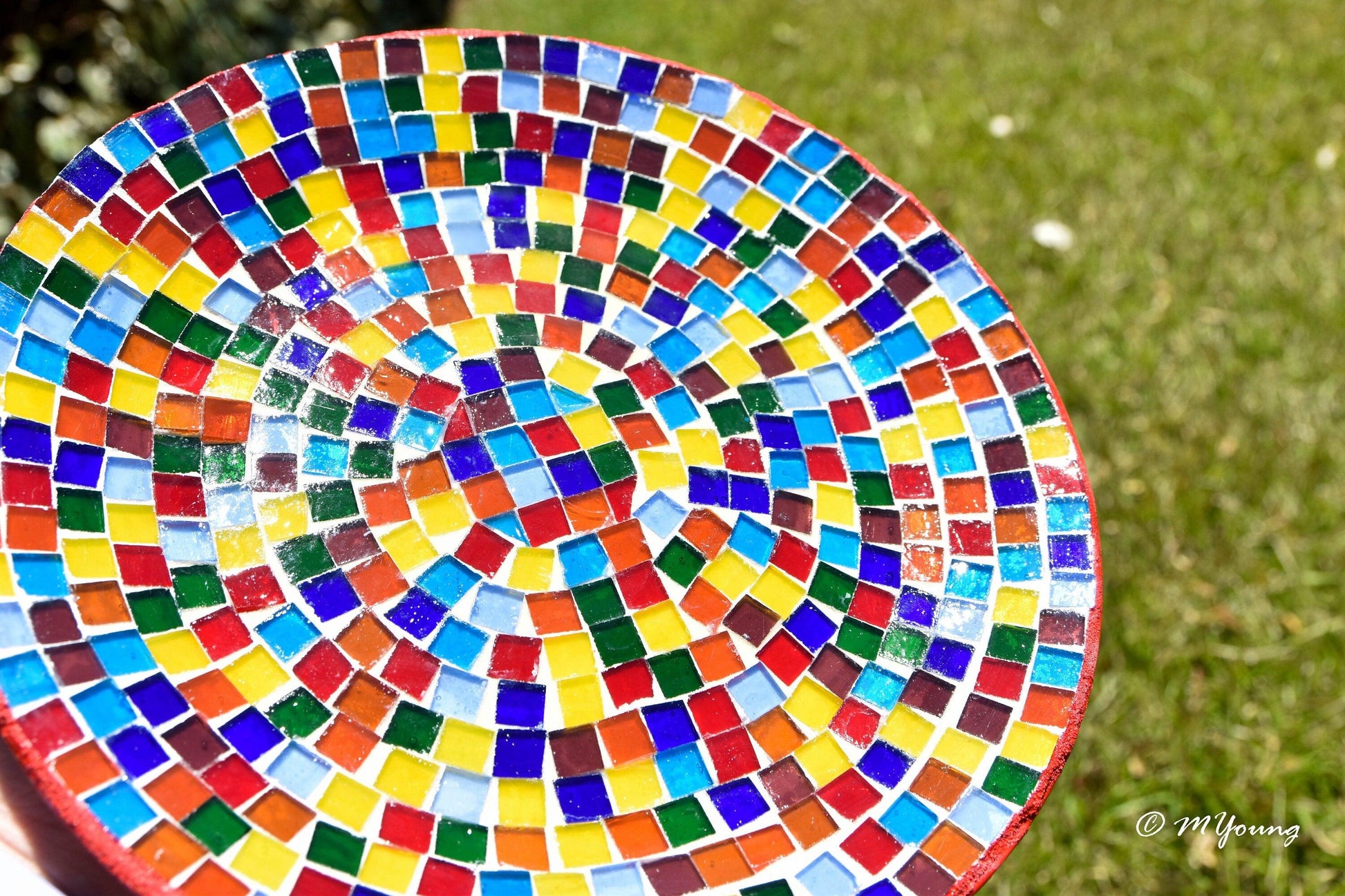 Colorful rainbow mosaic decorative wall plate featuring vibrant geometric patterns, perfect for wall decor.