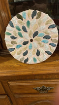 Handcrafted botanical petal mosaic plant stand with colorful floral design, ideal for displaying houseplants indoors.