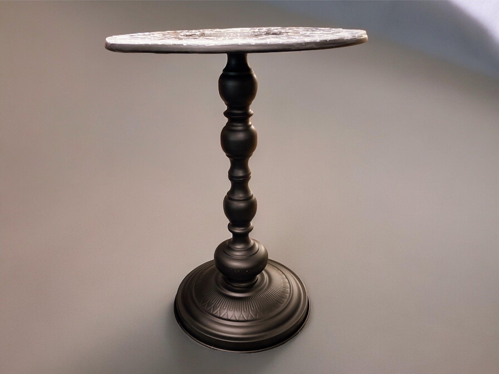 Round side table with iridescent gray and purple mosaic top on black metal base, 15 inches diameter and 20 inches tall.