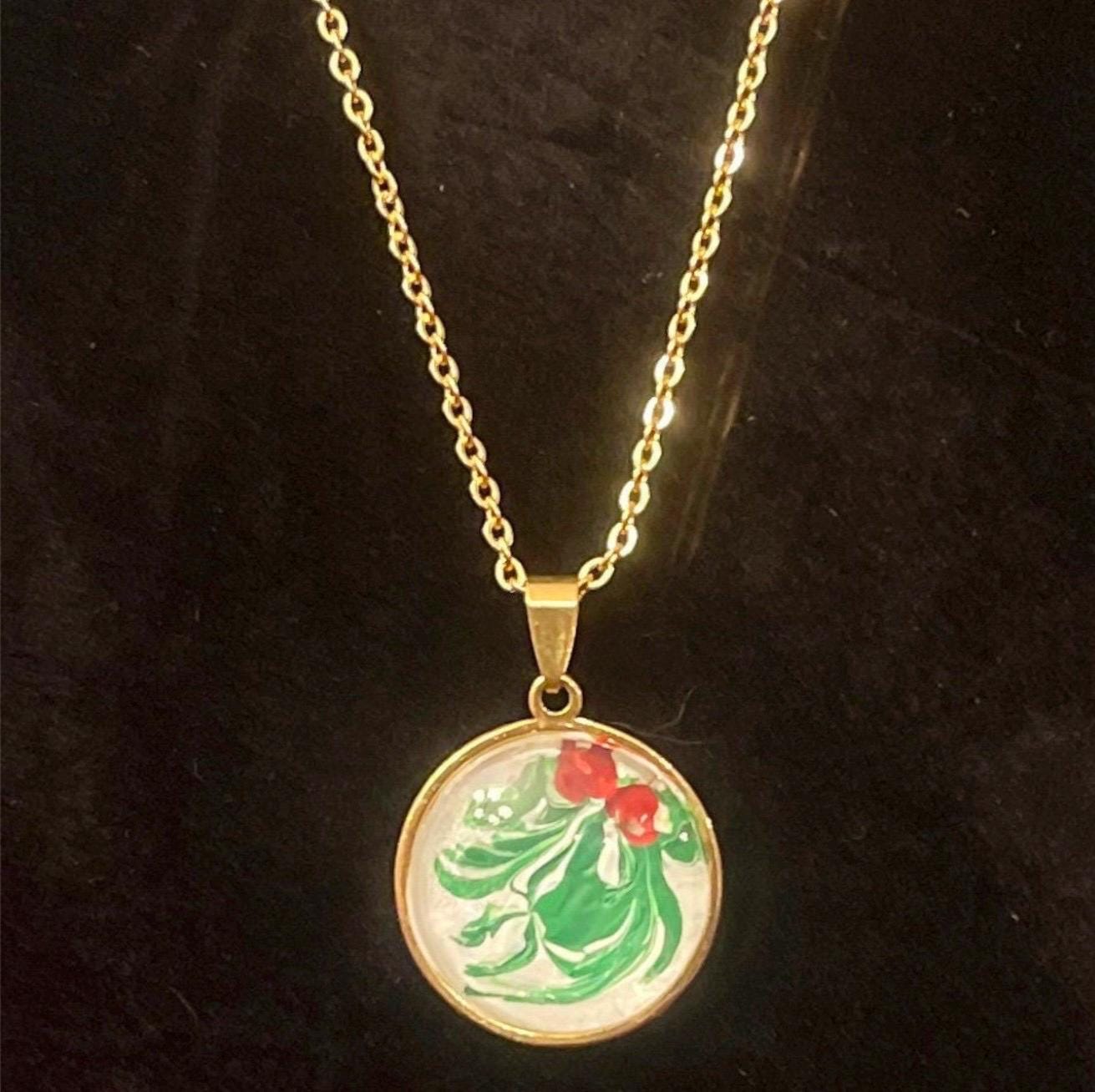Christmas Holly Pendant Necklace featuring a festive holly design on a silver chain, perfect for holiday accessories.