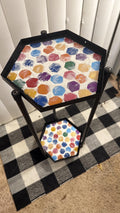 Handcrafted 2-tier rainbow mosaic plant stand with colorful tiled surface, perfect for indoor or outdoor plant display.