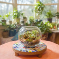 Colorful handcrafted polka dot rainbow mosaic plant stand by Miss Bette's Creations, featuring vibrant mosaic patterns and sturdy construction.