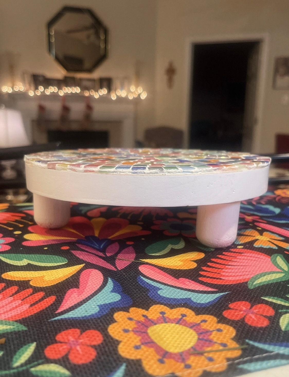 Handcrafted white rainbow mosaic plant stand with colorful tile patterns, ideal for indoor or outdoor plant displays.