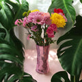 Handcrafted pink disco ball mirror vase featuring reflective mirrored surfaces and a rounded shape, perfect for decorative display.