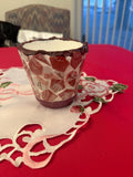 Handcrafted broken china mosaic flower pot with colorful floral design, showcasing intricate craftsmanship and vibrant mosaic patterns.