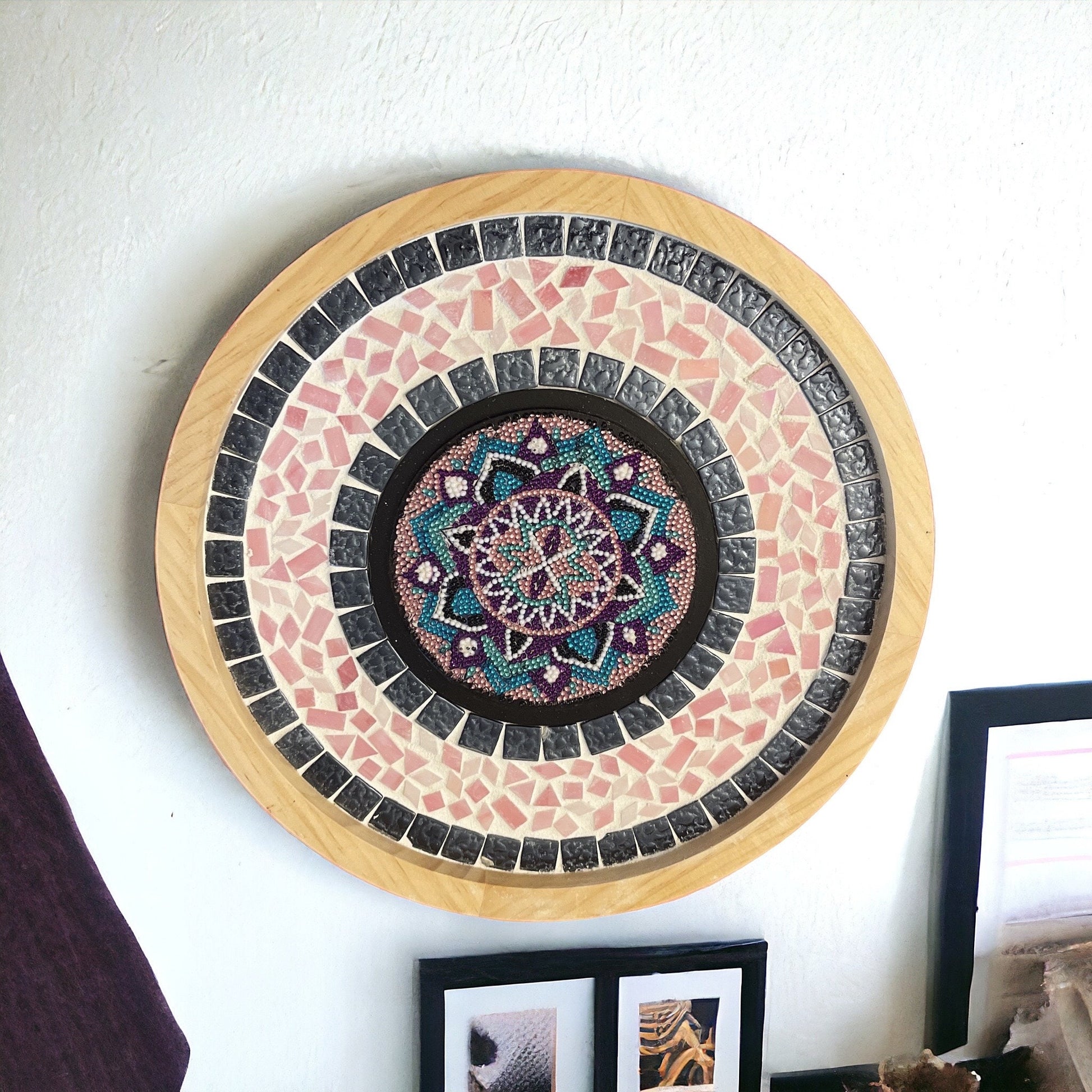 Colorful handcrafted circular mosaic mandala wall art featuring intricate geometric patterns and vibrant tile designs.