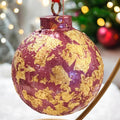 Rose and gold leaf Christmas ornament with intricate detailing, ideal for holiday decorating.