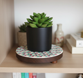 Handcrafted pink and green mosaic plant stand by Miss Bette's Creations, featuring colorful tiled design for indoor or outdoor use.
