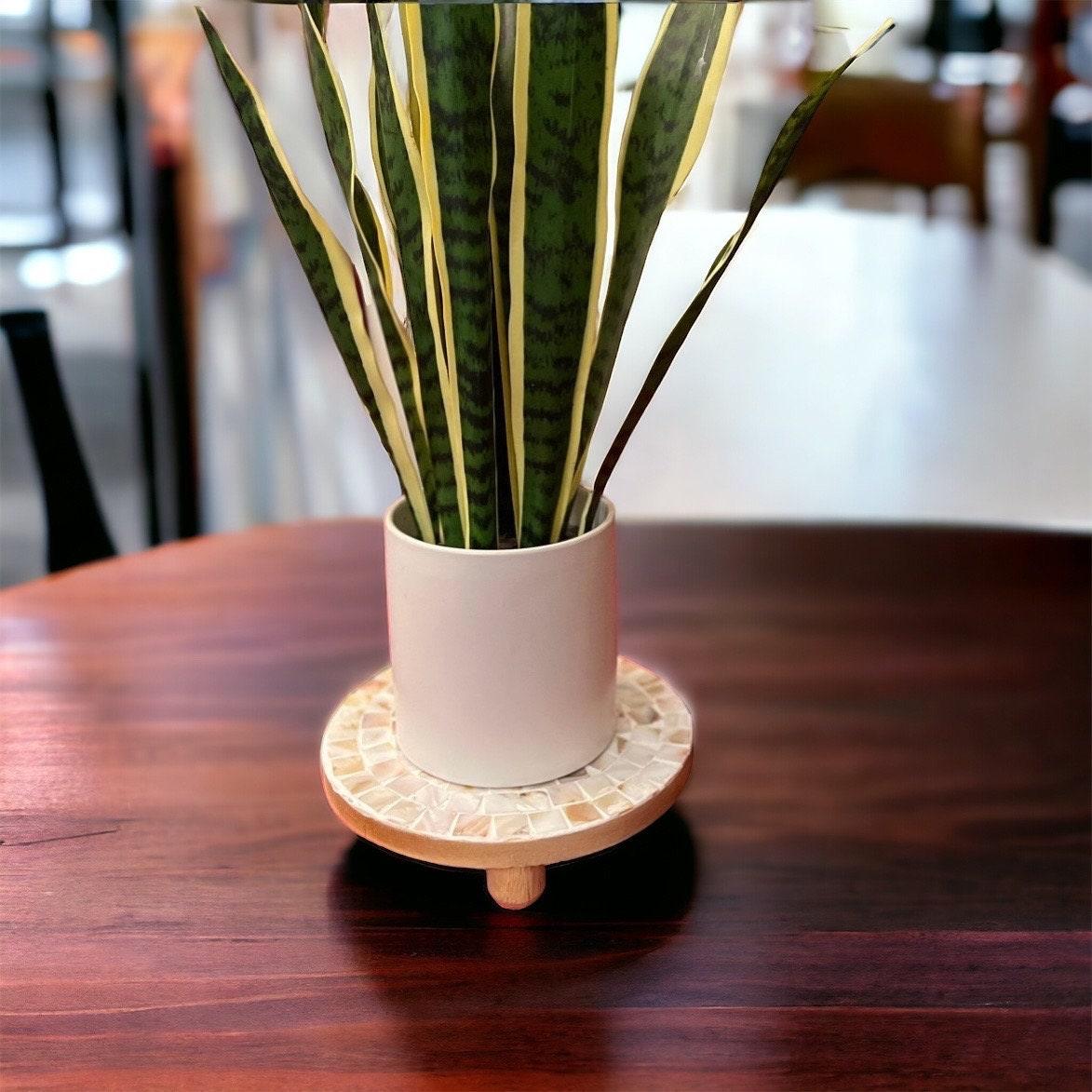Handmade mother of pearl mosaic plant stand with intricate patterns, showcasing a stylish and decorative home accent piece.