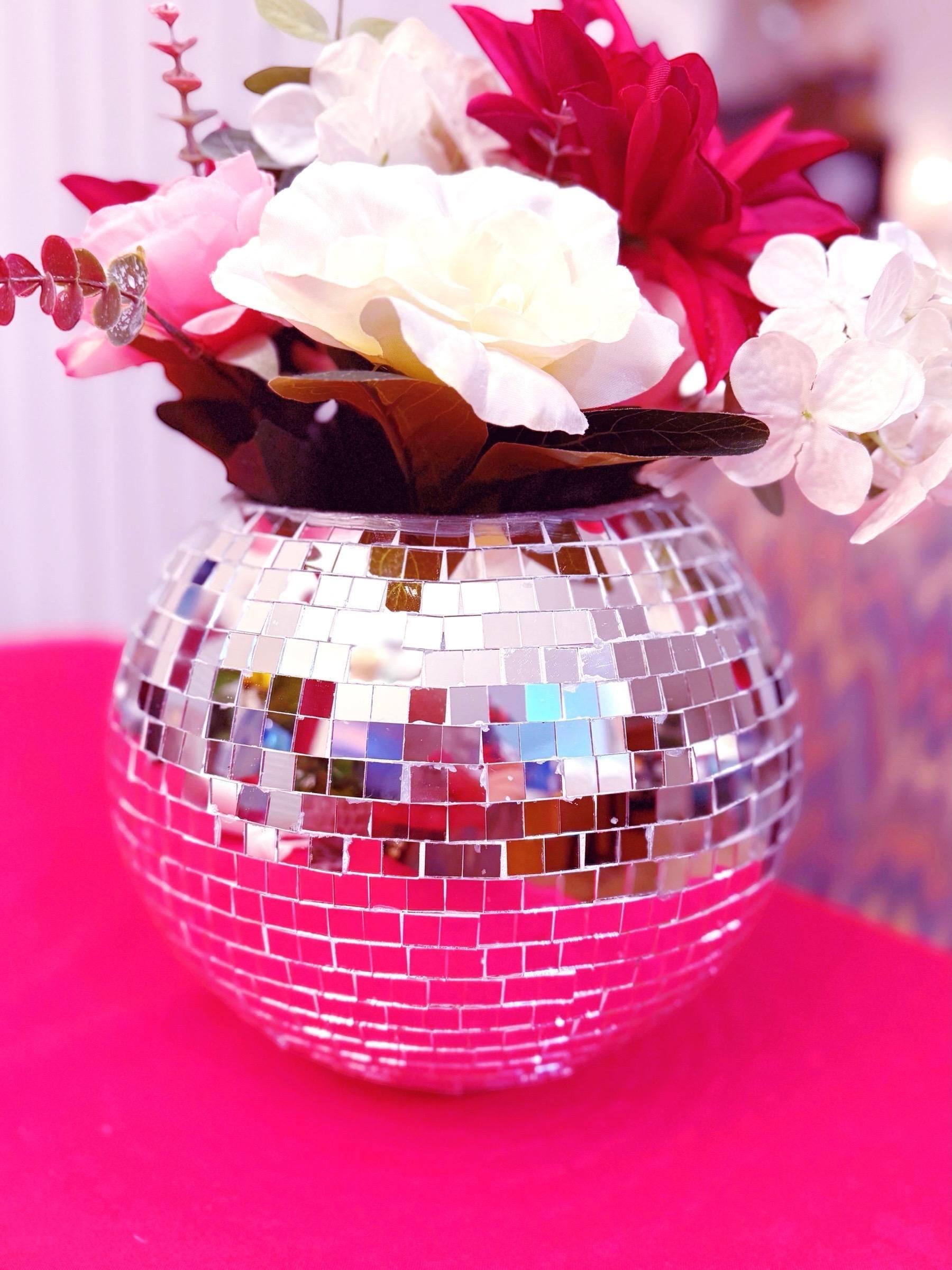 Mirror ball disco globe vase with reflective surface, spherical design, perfect for decorative displays and modern home decor.