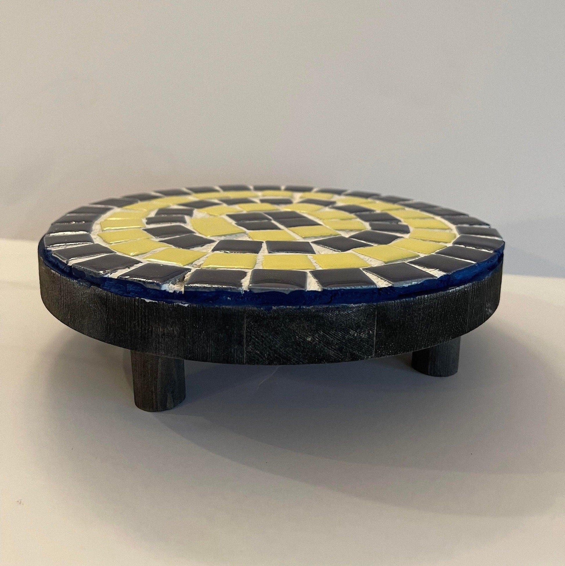 Handmade cobalt blue and yellow mosaic plant stand with intricate tile design, perfect for displaying indoor or outdoor plants.