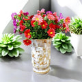 Handcrafted tapered mosaic vase with mother of pearl inlay, showcasing intricate mosaic patterns and a smooth, elegant shape.