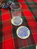 Artisanal blue marble mosaic coaster featuring intricate pattern and polished finish, perfect for protecting surfaces.