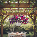 Hanging disco ball planter from Miss Bette's Creations with artificial pink carnations, decorative and modern home decor.